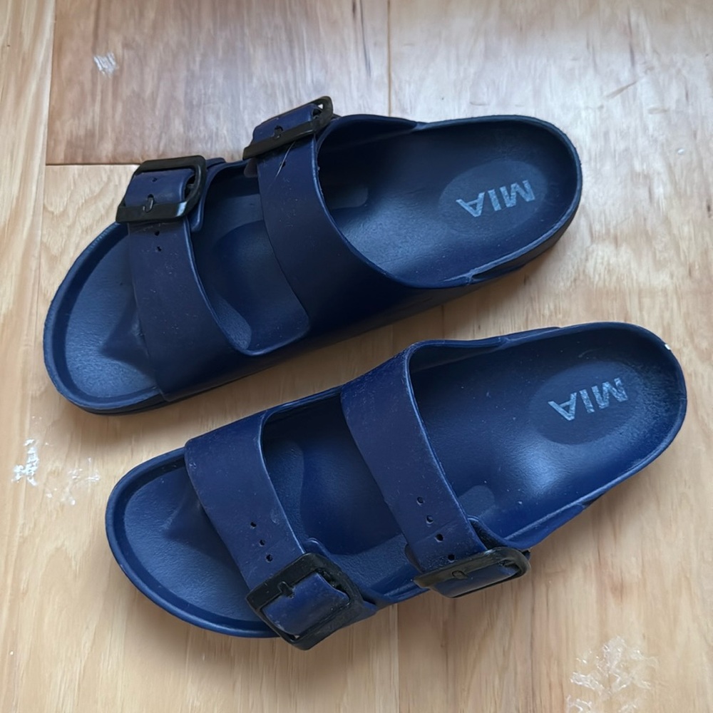 Bright navy plastic MIA slip on. Size 7